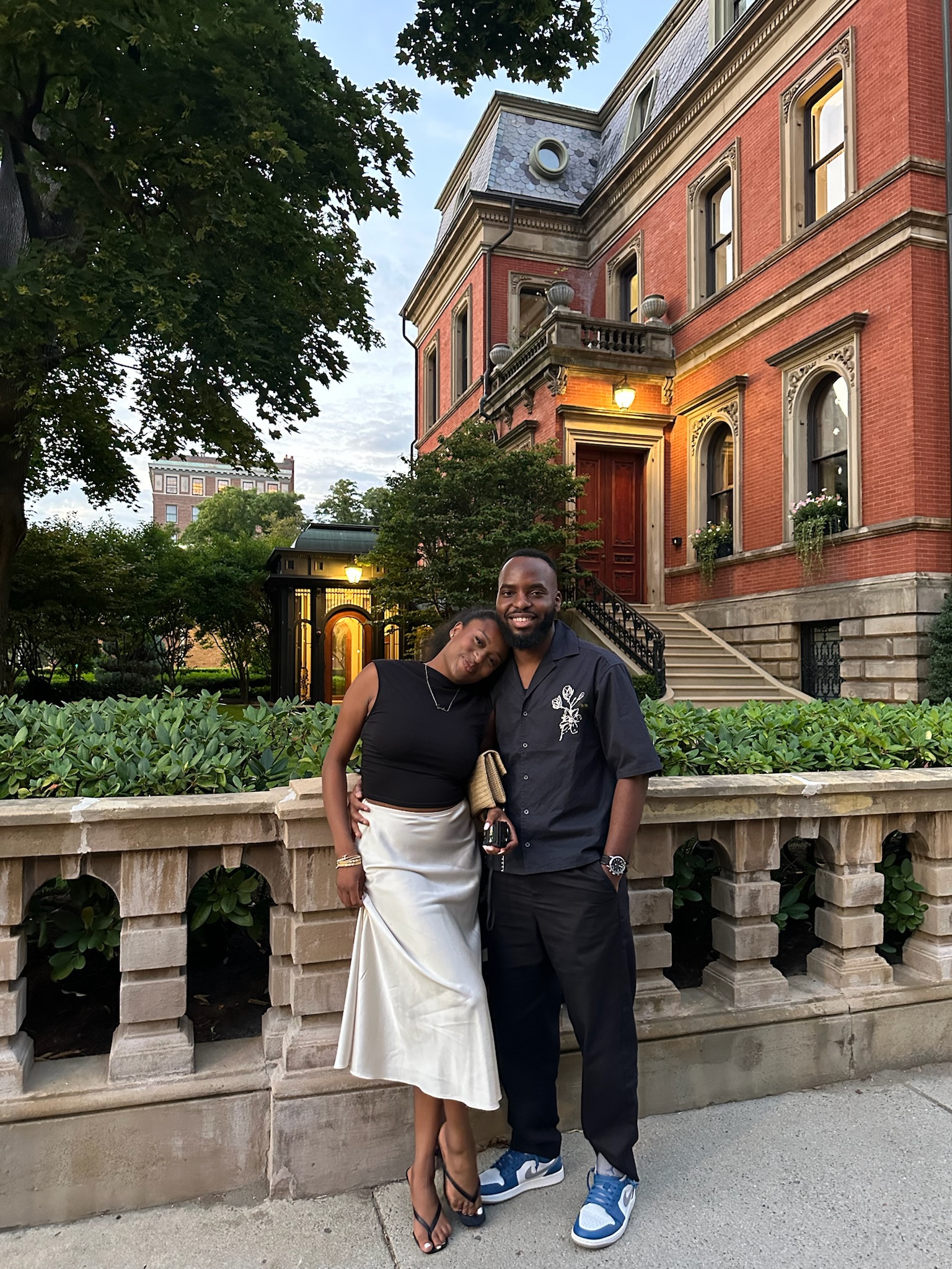 Romantic embrace near historic manor