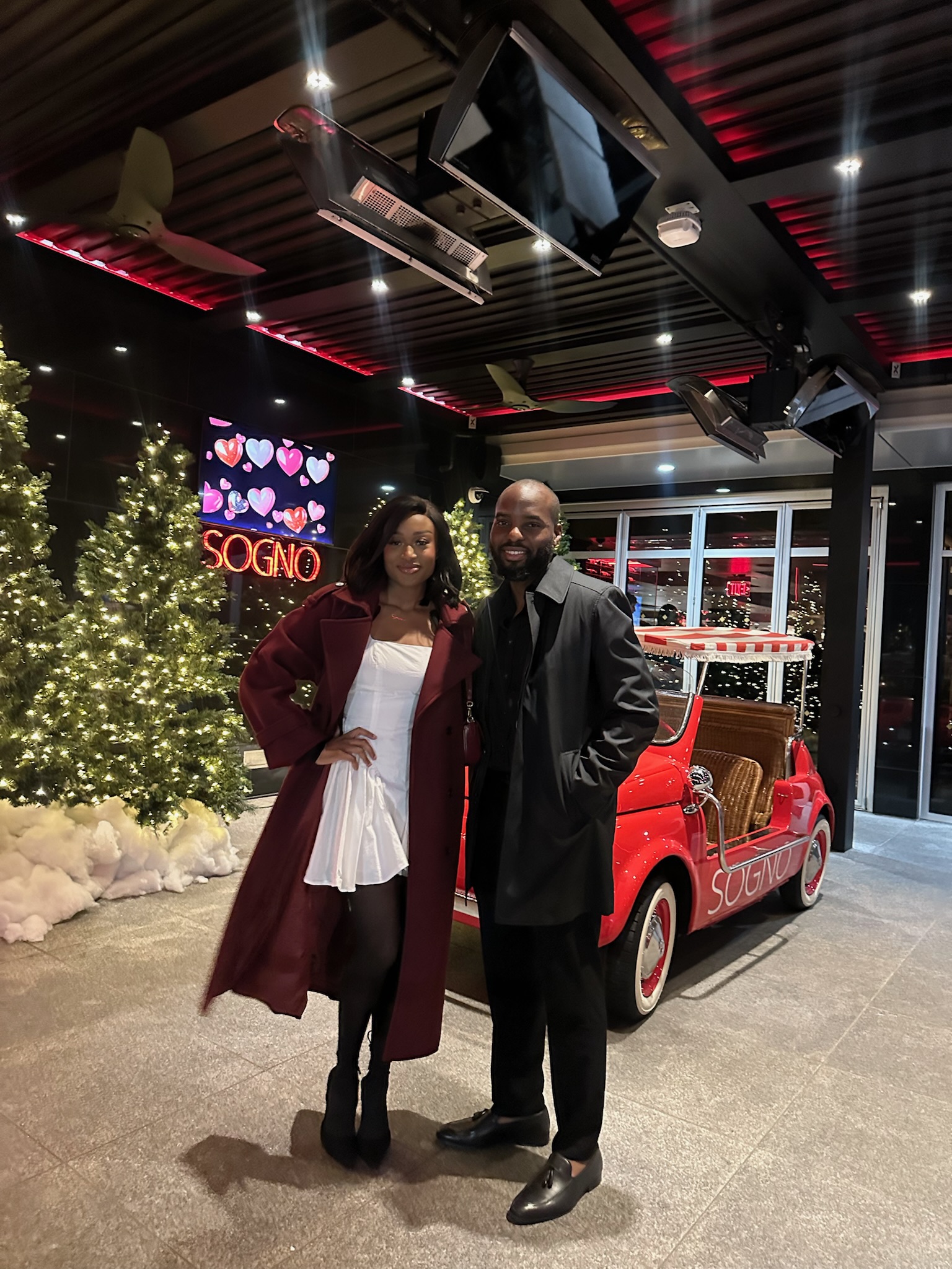White dress and red trench coat holiday portrait